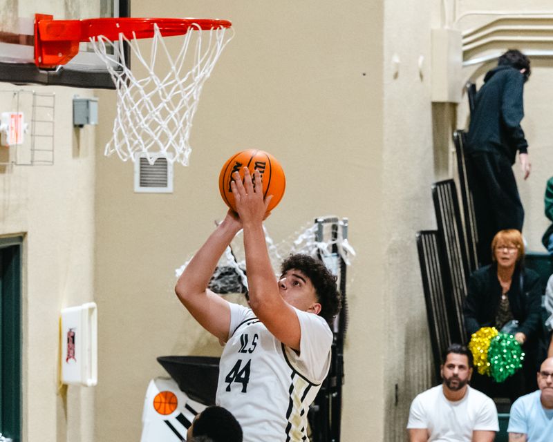 ILS boys basketball team senior hits 2 points for the royal lions. 
