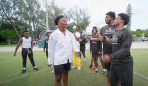 IShowSpeed & Lamar Jackson engage with members of the ILS football team.