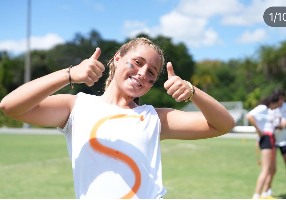 That's me! All smiles because I get to participate in the best high school sports activity there is: PowderPuff football.