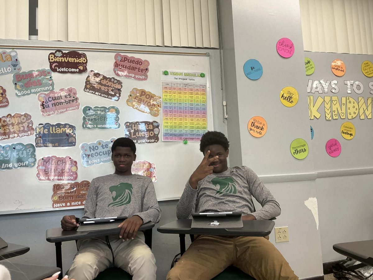 Freshmen football players Antwan and Tramann Jones wear the Nike rivalry shirts showing support for their team the day of the game.