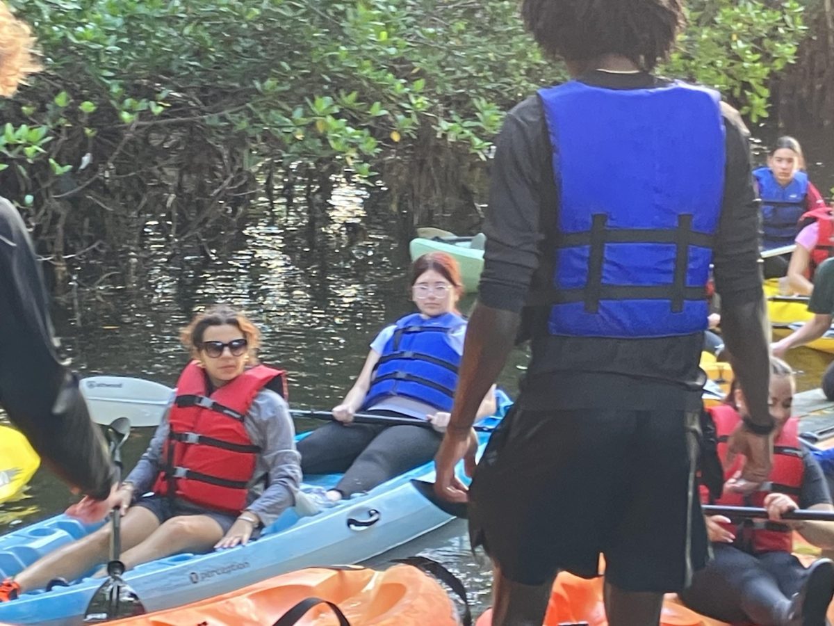 Seniors Lara Torrens and Kaylen Borges return from kayaking in Biscayne Bay with their Environmental Science class.