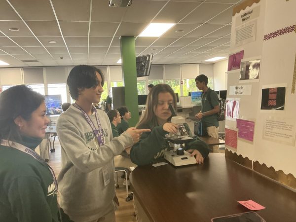 Students use the microscopes to study the different types of tissues found in the human body.