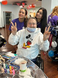 Veterans and club members engage in arts and crafts.