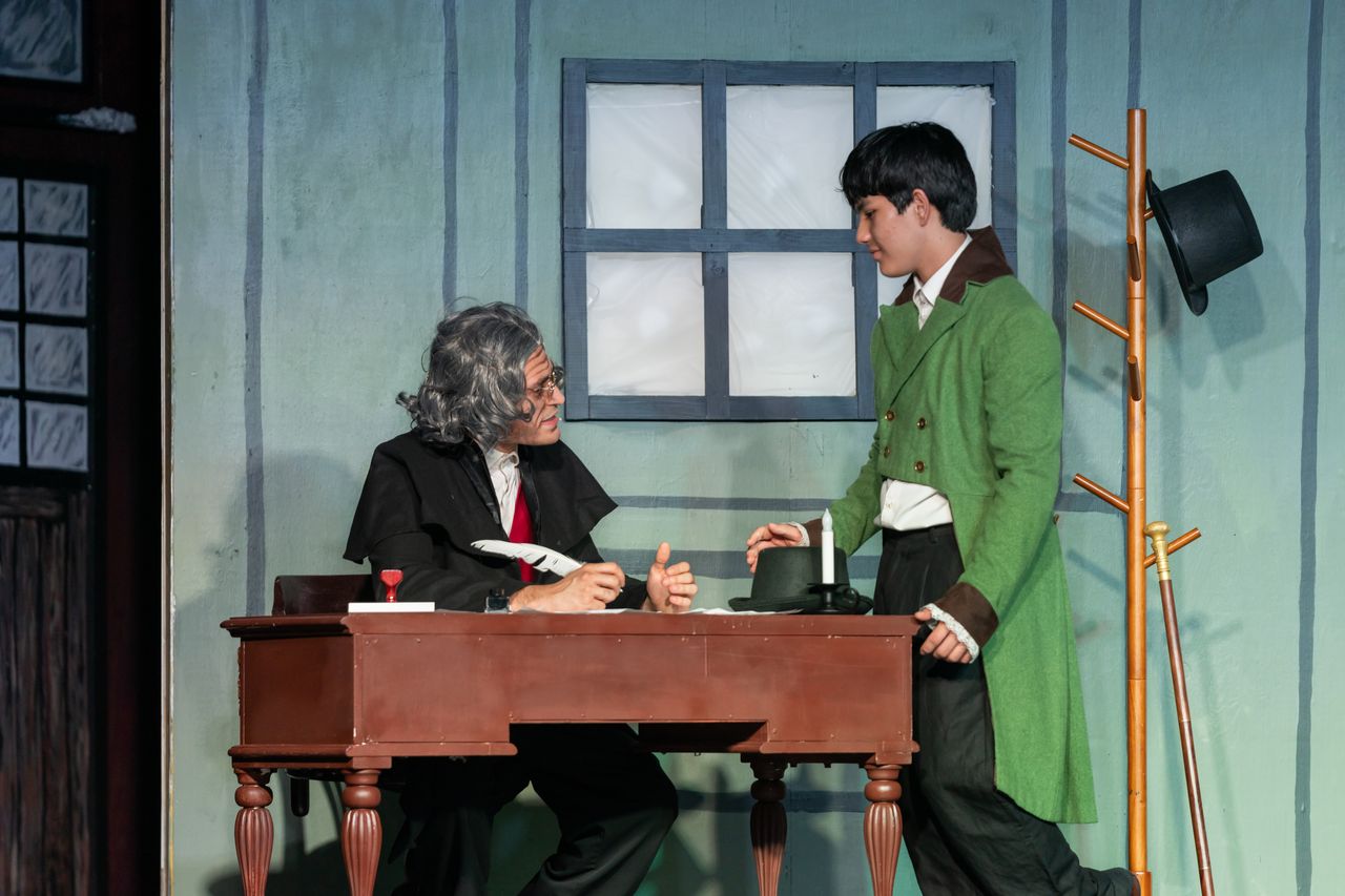 Scrooge argues with his cheery nephew Fred over Christmas. (Ernesto Losada, Matthew Schultz)