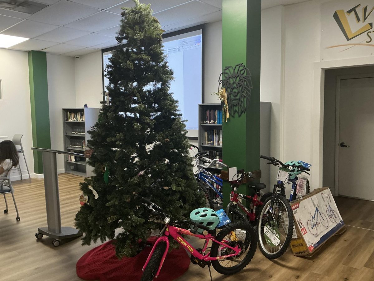 Bicycles and holiday decorations fill a community space, reflecting how meaningful gifts go beyond technology during the holiday season.