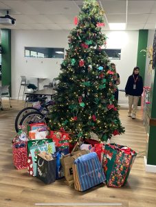 The Angel Tree begins to be filled with the donations from the ILS community.