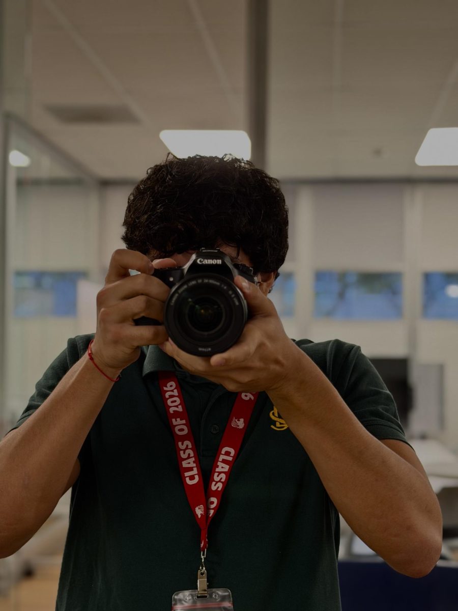 Senior Martin Sarmiento Pombo takes photos and videos for LTV in the Student Learning Center. It is his fourth year as a photographer and videographer for the program, and he is now a Senior Leader. He hurries to get content before the 10:40 AM deadline, when LTV airs to the whole school. 