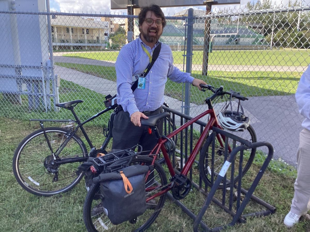 Mr. Gamwell with the bike his students came together to buy for him.