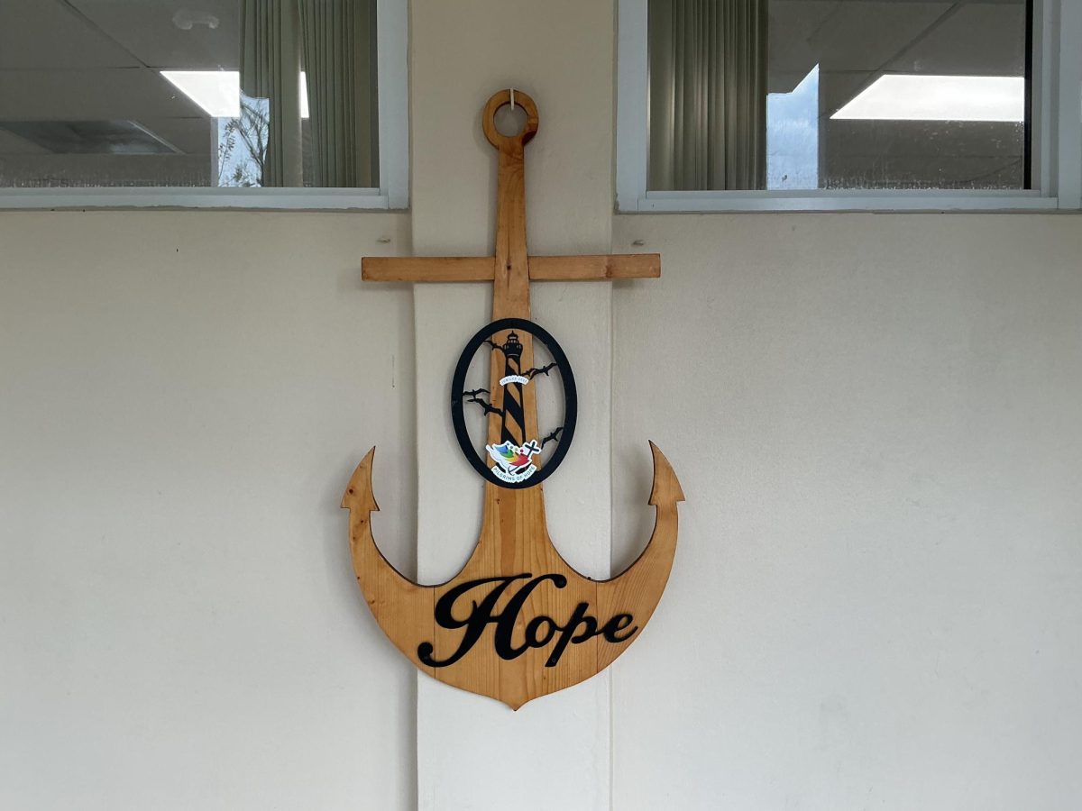 This close up shot of the Christian Anchor of Christ hung up in a hallway reminds the community of this year's strenna or theme..
