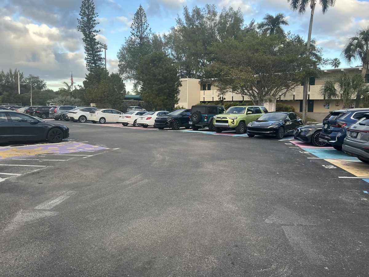 These are cars parked with no one around them during e block in the senior parking lot. This object represents the lack of people in an often crowded area