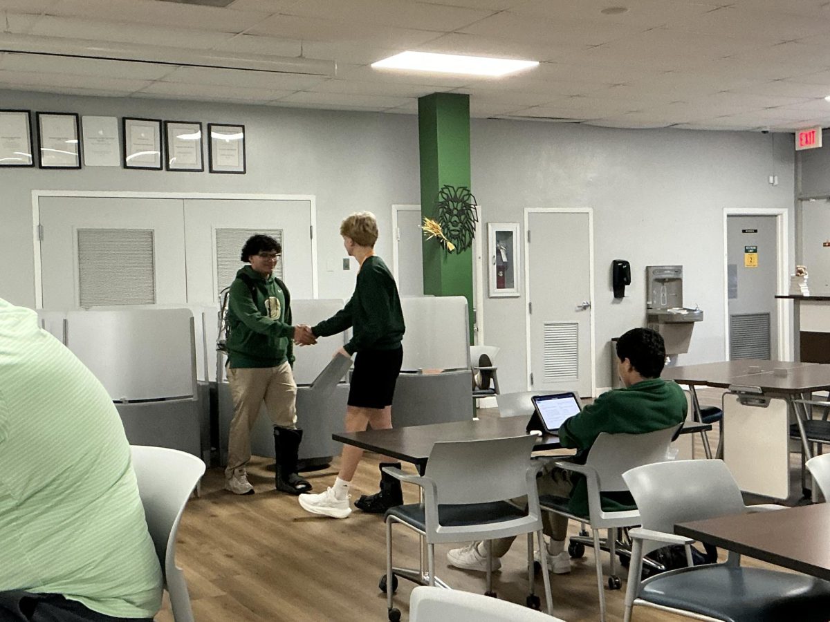 Two teachers sit quietly in the Student Learning Center, working. A simple, but exemplary representation of the atmosphere of the SLC. A place for innovation, a place for collaboration, but most of all, a place for focus, rest, and commitment. 