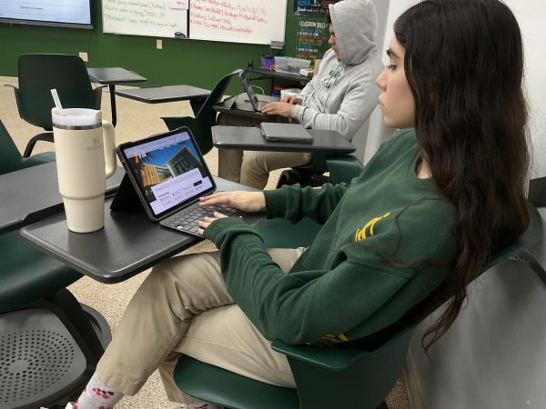 Senior Emma Angeli uses her free period to complete schoolwork while waiting for college decisions from Florida International University, expected to be released Jan. 21.