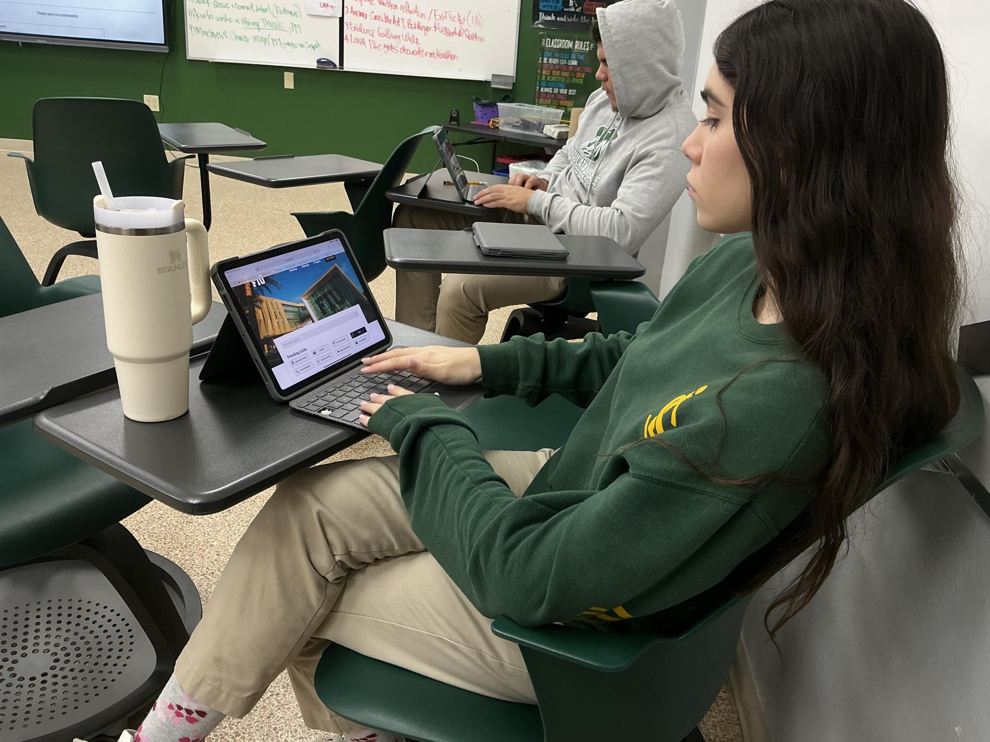 Senior Emma Angeli uses her free period to complete schoolwork while waiting for college decisions from Florida International University, expected to be released Jan. 21.