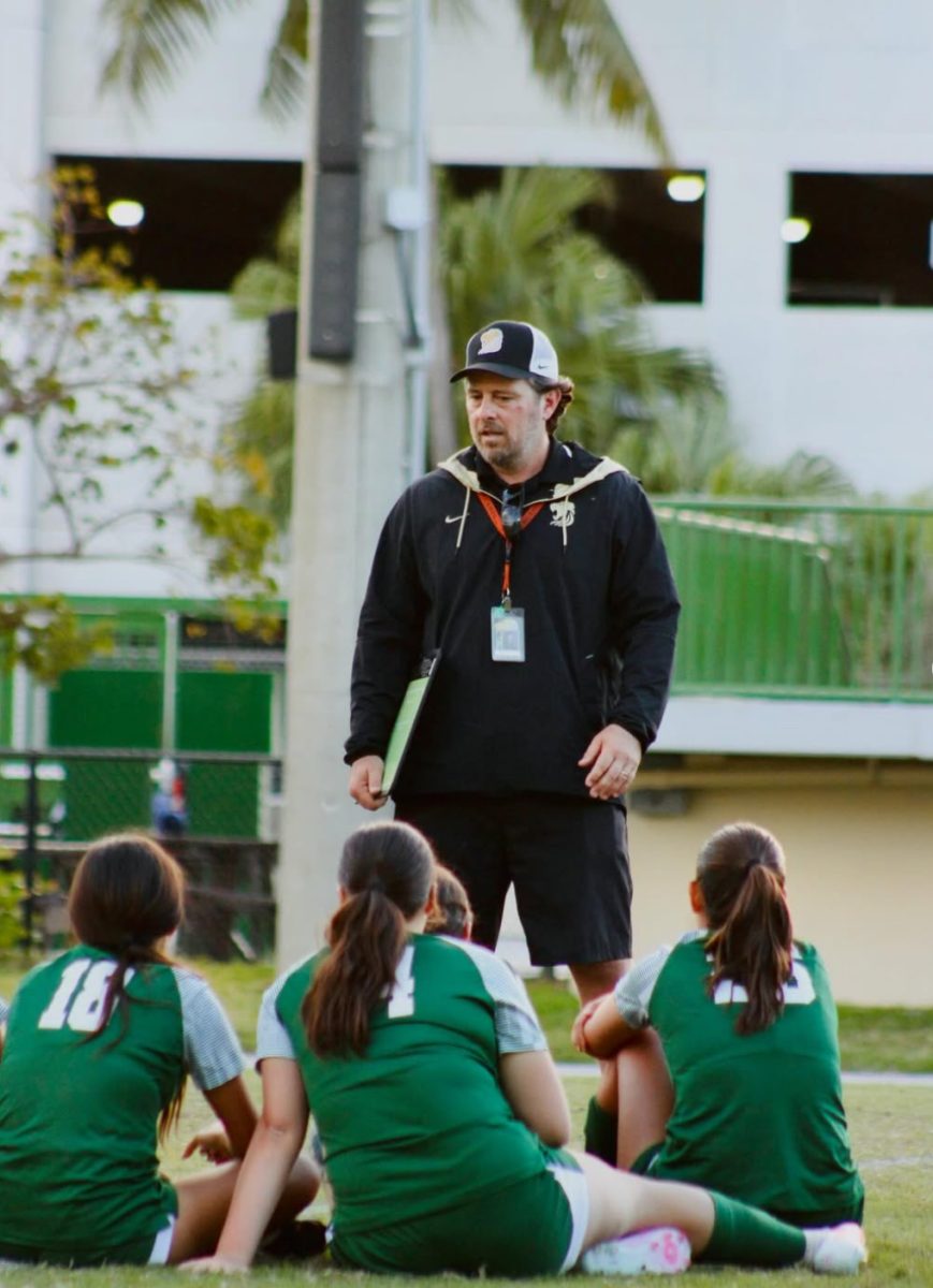 Mr. Anthony Vuono, Head Coach of the Girls Varsity Soccer Team, addresses to the team during a break.