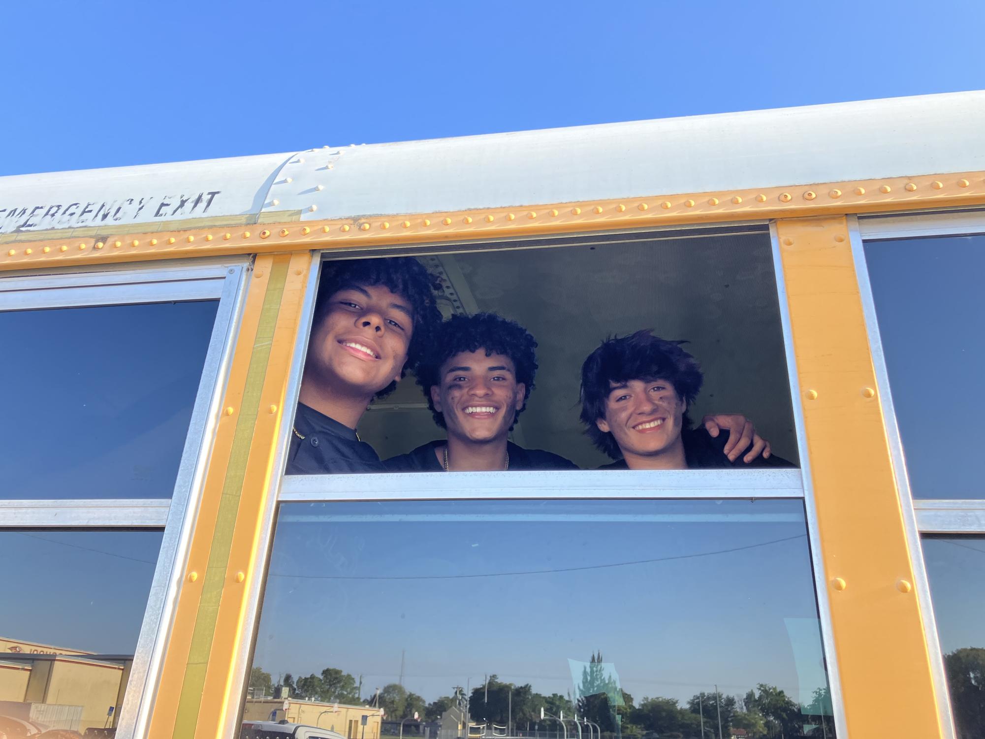 Sophomore Evan Myrtil with seniors who graduated last May boards the school bus after a game. Social media posts affect athletes as well since sports are a popular subject online.