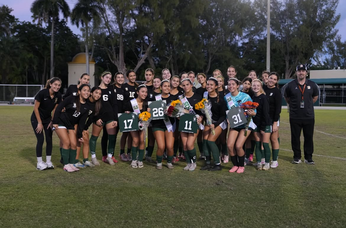 The ILS Varsity Girls' Soccer team poses for a picture during the Senior Night Ceremony
