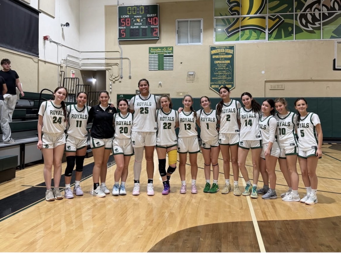 The Girls Basketball team gathers for a team picture after their big win against Ransom. 