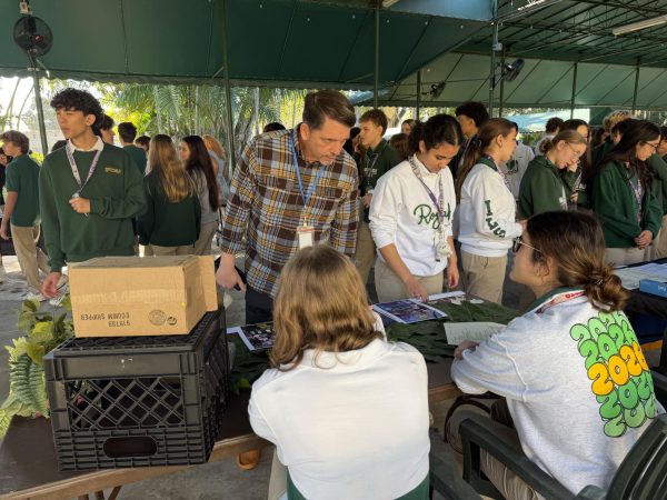 Students approach one of the theater elective to learn more about the variety of classes offered in Fine Arts.