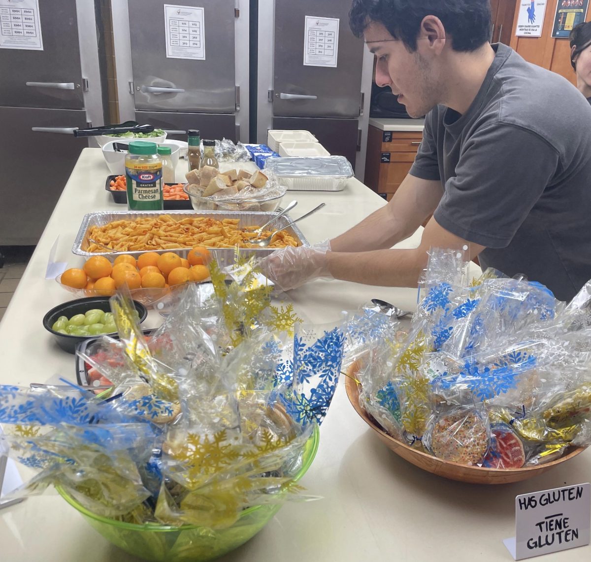 A volunteer helps out at the Ronald McDonald House by setting up food for families.
