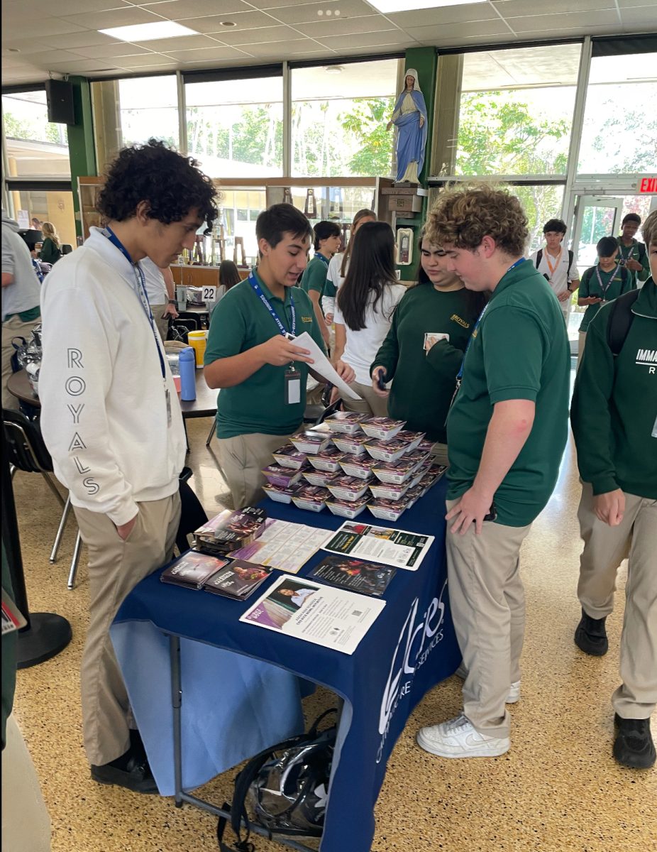 Rodrigo De Lamo and Ethan Rios speak to students about the rice bowl during lunch. 