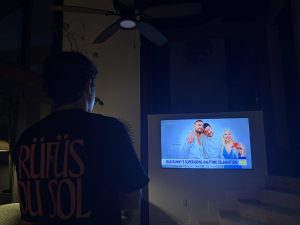 Watching the big game in pure focus — captivated by Bad Bunny’s electrifying Super Bowl halftime performance on screen, was how producers originally meant the performance to be enjoyed knowing millions worldwide would be watching it on their televisions.