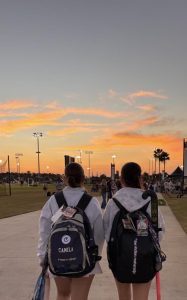 Players walk off into the sunset after an arduous day of competition.