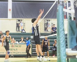 Sophomore Marcelo Lopez jumps for the block during a recent volleyball match.