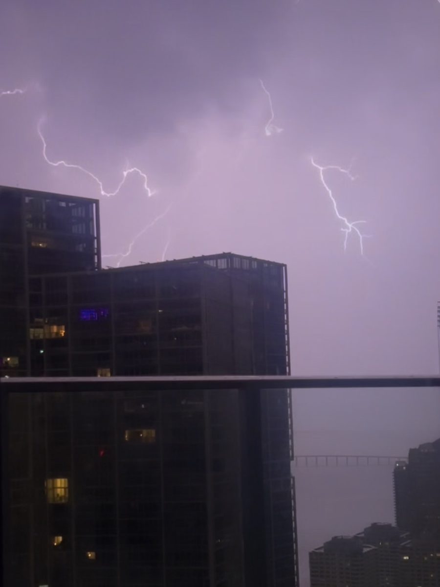 A purple sky serves as the backdrop for lightning bolts illuminating another Miami evening.