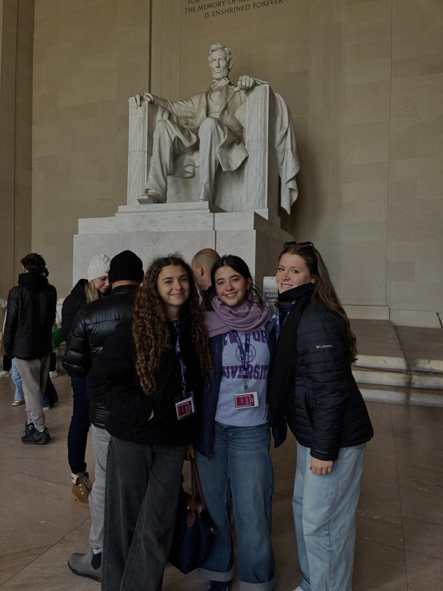 Immaculata-La Salle students Naomi Gilmore, Paola Orelle, & Sabina Morelli stand in front of the iconic Abraham Lincoln, located in the Lincoln Memorial in Washington D.C. During their Close Up trip.