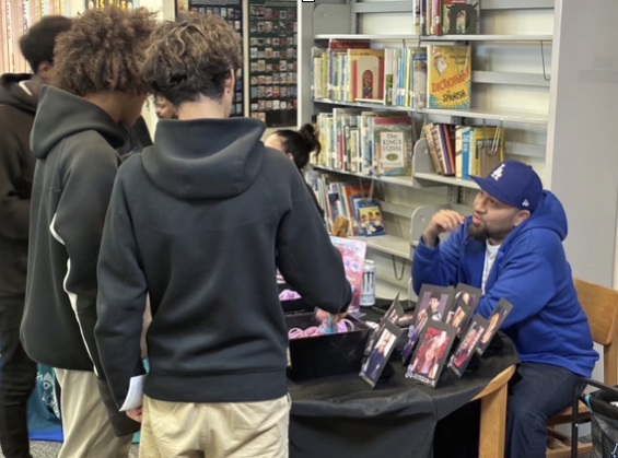 A Fight Fentanyl representative speaks with students during a community outreach event, sharing personal stories and providing education on overdose prevention and available resources.