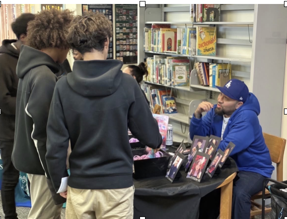 A Fight Fentanyl representative speaks with students during a community outreach event, sharing personal stories and providing education on overdose prevention and available resources.