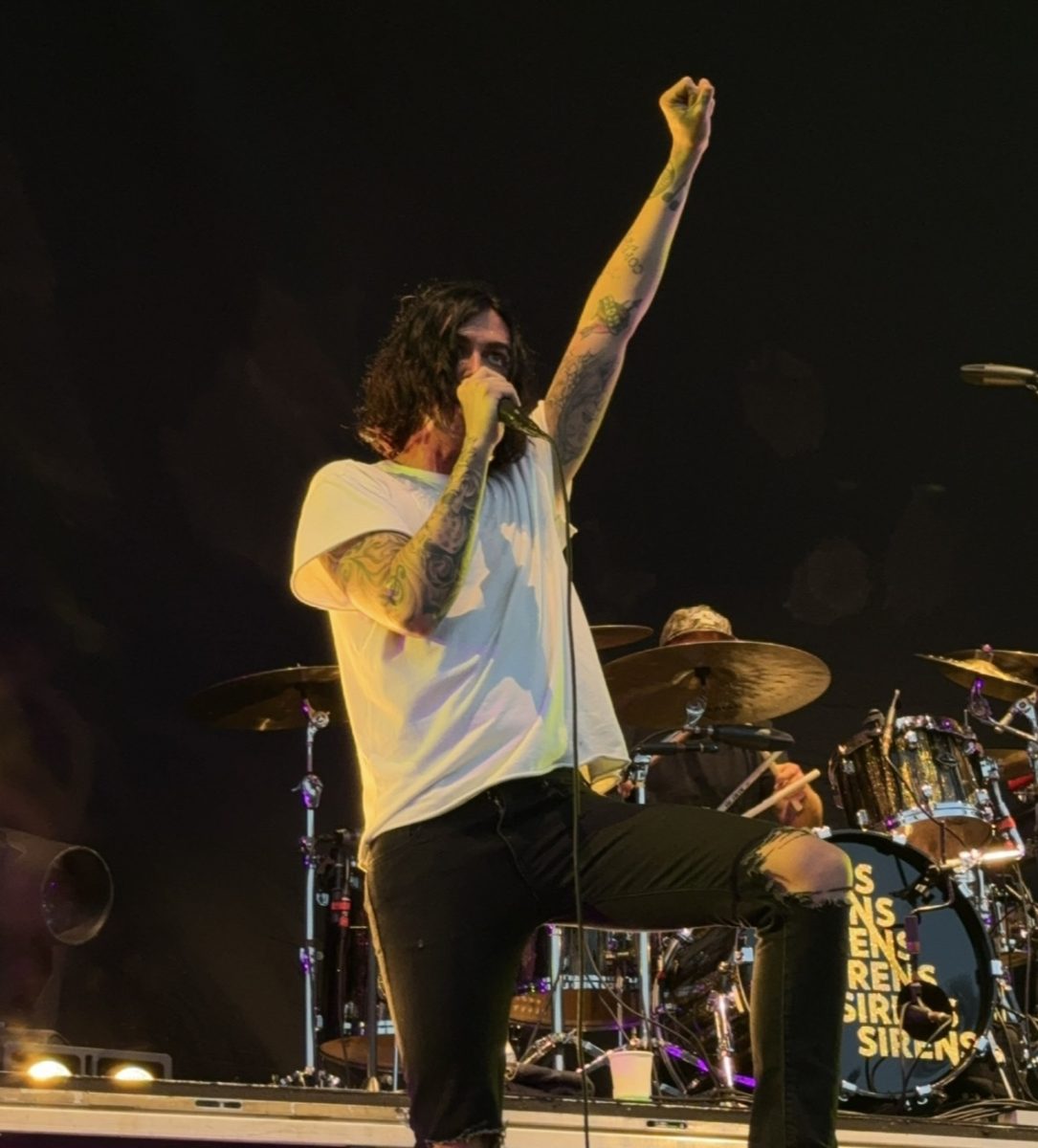 Lead singer for Sleeping with Sirens, Kellin Quinn, recently released the band's latest single, "An Ending in Itself." Performing in Daytona Beach, Florida, the band opened Pierce the Veil.