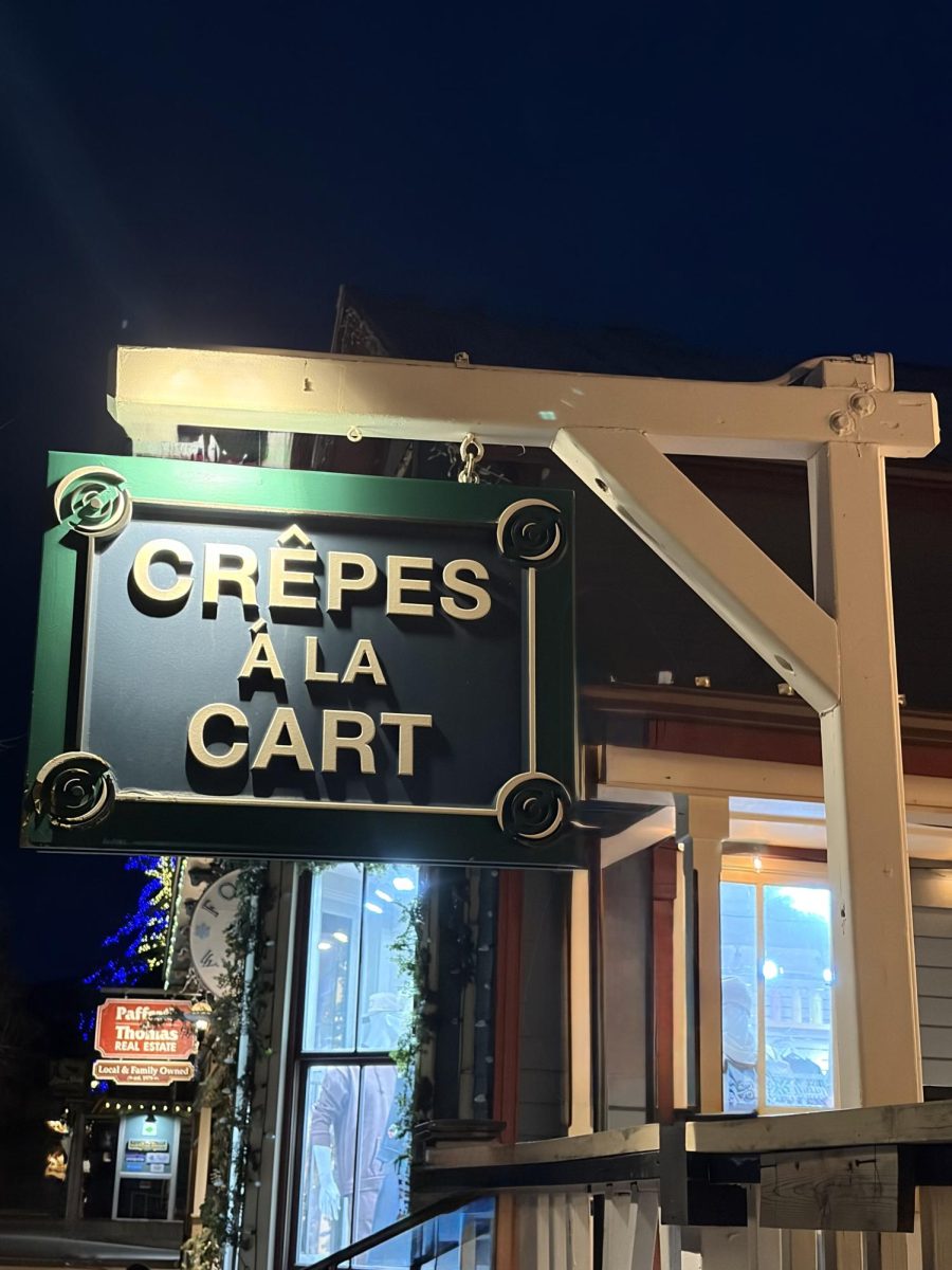 The outdoor sign of Crêpes A La Cart welcomes visitors for warm, cozy, and delicious dining experience.