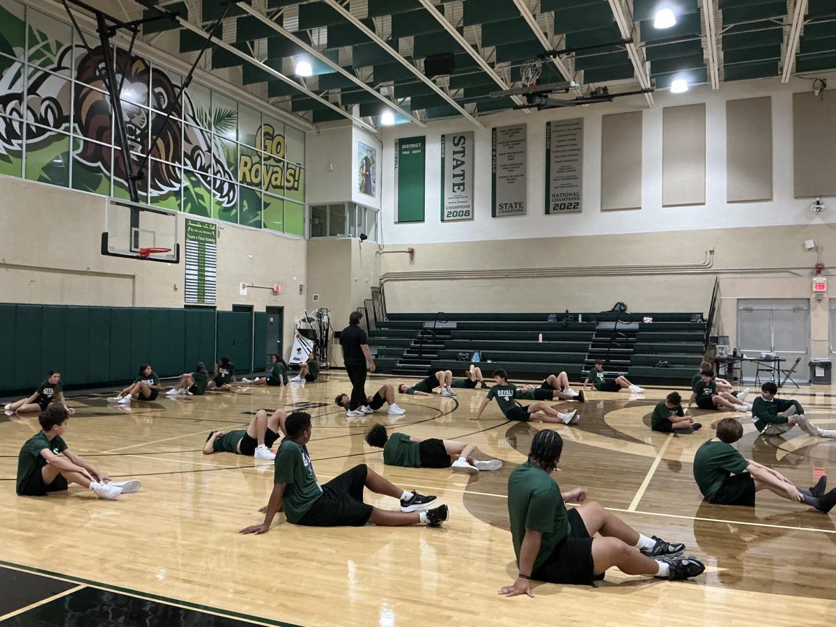 Freshman class does ab workout during physical education while wearing ILS gym clothes 