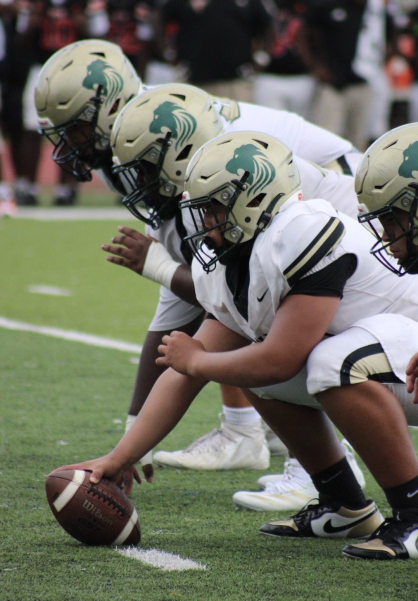 ILS football team lines up for a snap during the Friday game 