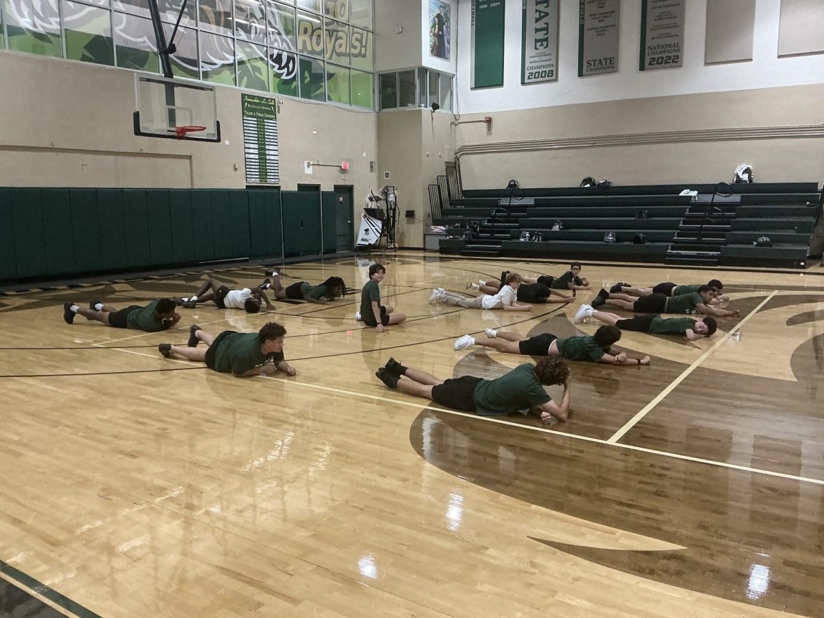 ILS Freshman stretch and get ready for Physical Education in the Gym 