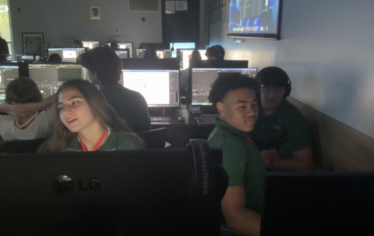 Sophomore John Anthony McCray shares his work with his classmates in his LTV class at Immaculata-La Salle during E Block.
