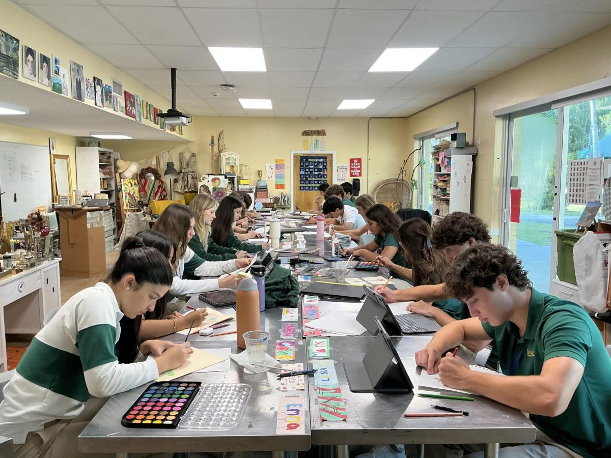 Mrs. Wildenburg E Block art design students work together and apply watercolors and diverse techniques to create Latin crosses. 