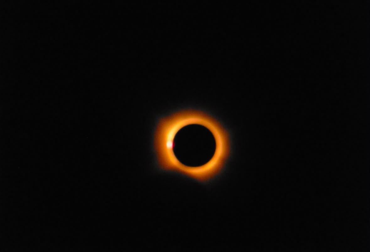 The total solar eclipse casts its umbra over crowds gathered to watch it in Spain.