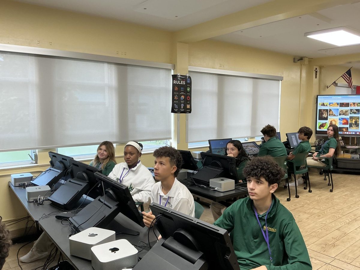 Freshmen: Adam Michael, Victoria Olaniel, Joceline Francois, Noah Obando, Lua Travelstead , Emma Junco focus on their computer screens as they participate in gravity design class.
