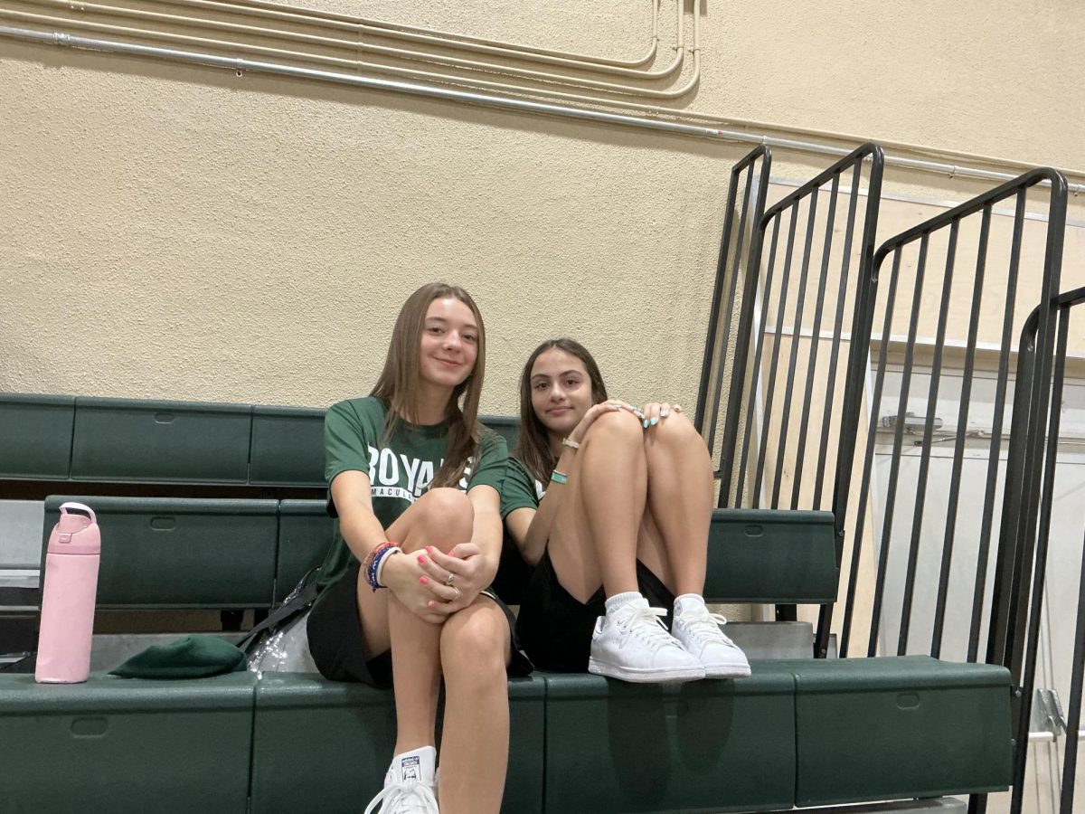 ILS freshman chatting before their first class of the day, PE. 