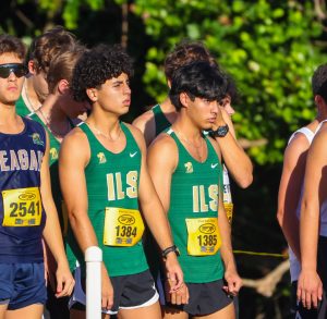 Andrew Brito and Daniel Brito, both ILS Cross Country runners, get ready at the starting line.