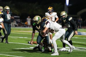 At last season's game versus Belen Jesuit, members of the ILS Varsity Football team demonstrate their strength and perseverance.