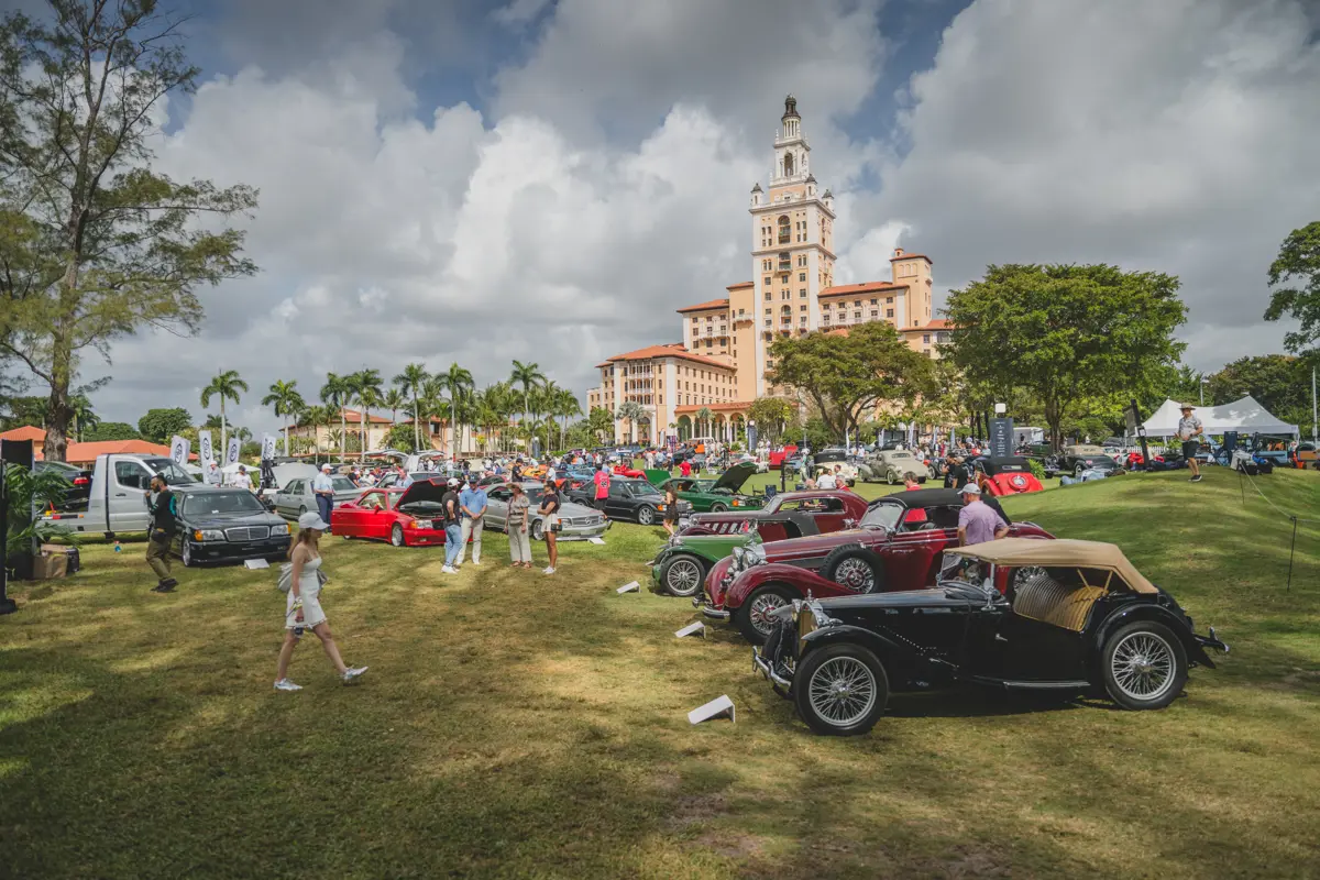 Tons of classic cars line up in front of the Biltmore Hotel