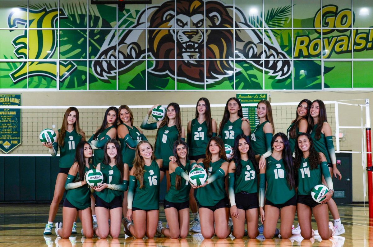 The Varsity Lady Royals Volleyball team pose for a team photo during Media Day.