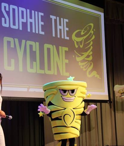 Sophie the Cyclone, Carrollton’s mascot, gets celebrated on a stage.