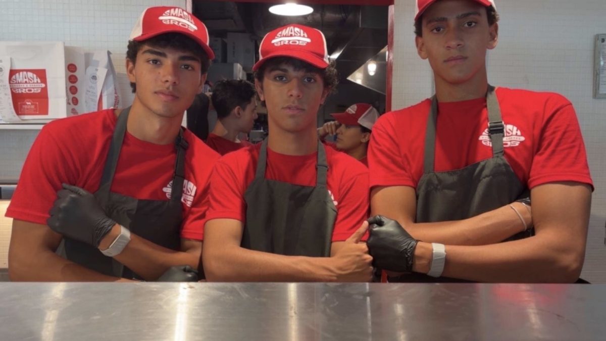 Immaculata-La Salle High School students and friends Matteo, Maxime, and Martin pose together during a shift at Smash Bros in Edgewater.