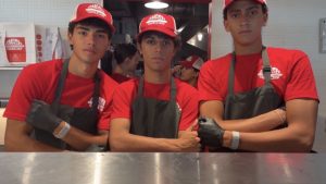 Immaculata-La Salle High School students and friends Matteo, Maxime, and Martin pose together during a shift at Smash Bros in Edgewater.