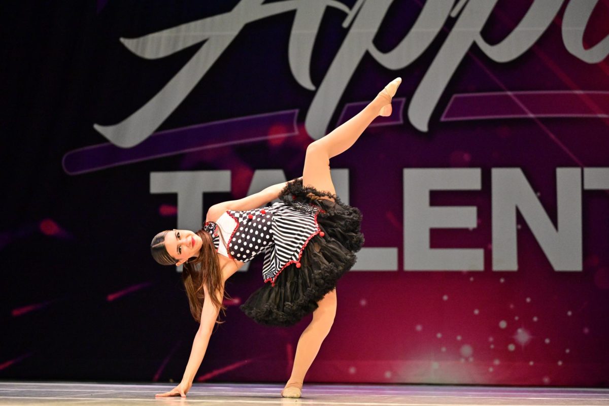 Senior Valentina Rodriguez takes the stage at a dance competition, showcasing the confidence she has developed through dance.