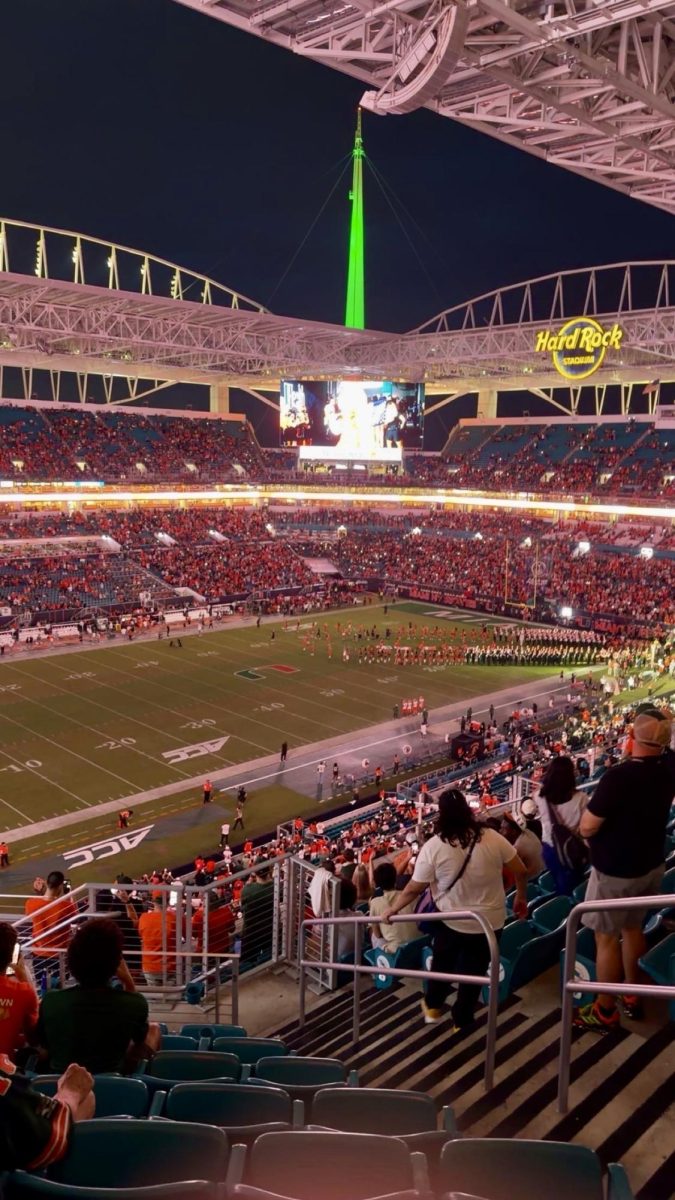Fans gather as Miami football players prepare for another exciting kickoff during the annual college football season.